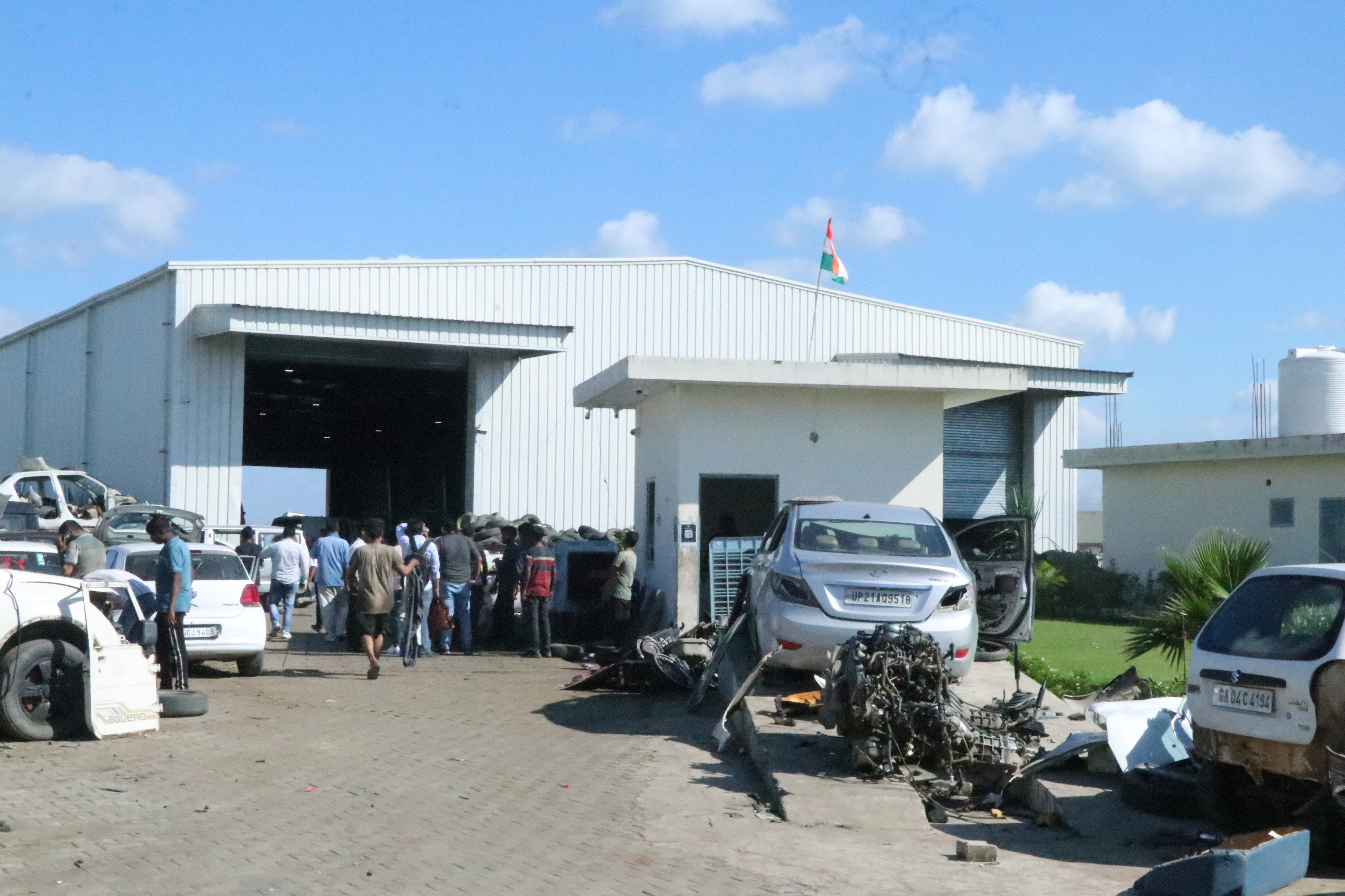 Tow truck carrying an old car for scrapping